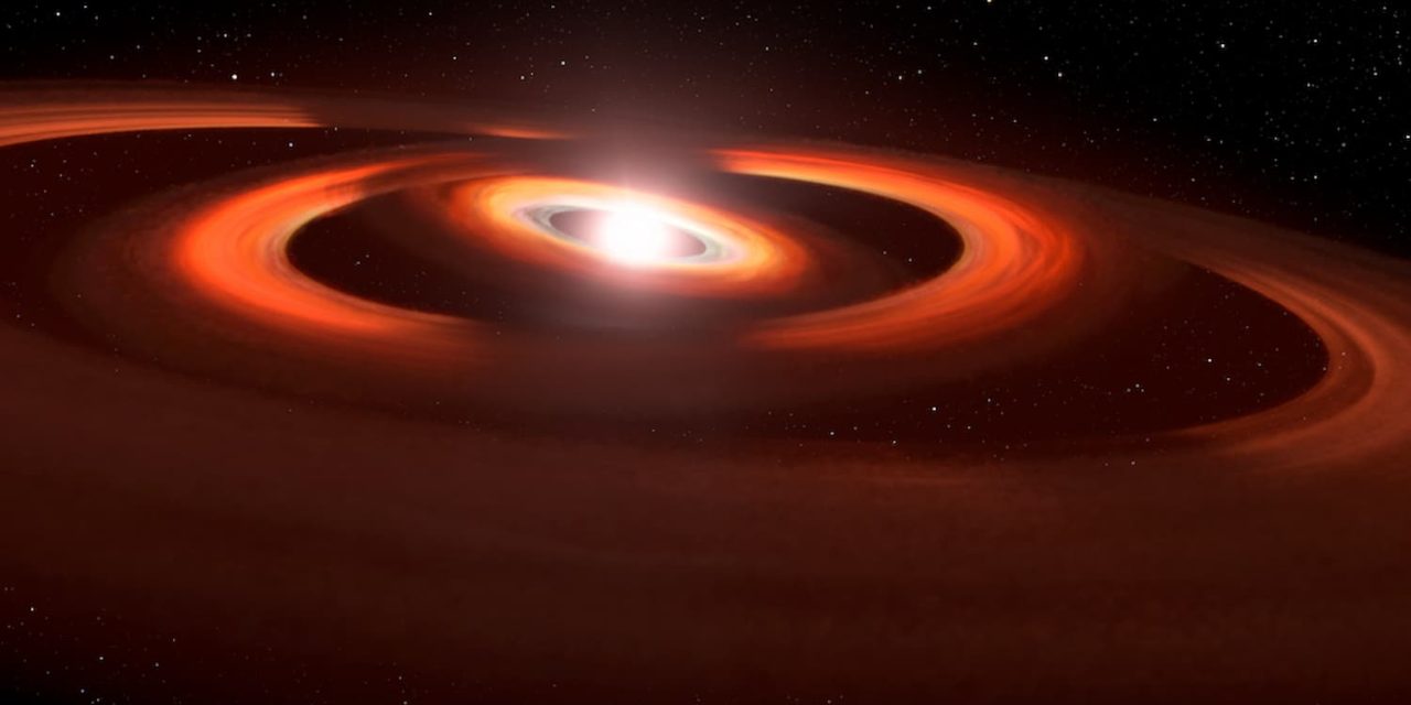 Una giovane stella è la culla di due pianeti 